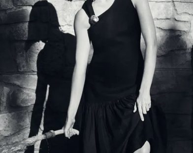 COS model wearing black dress